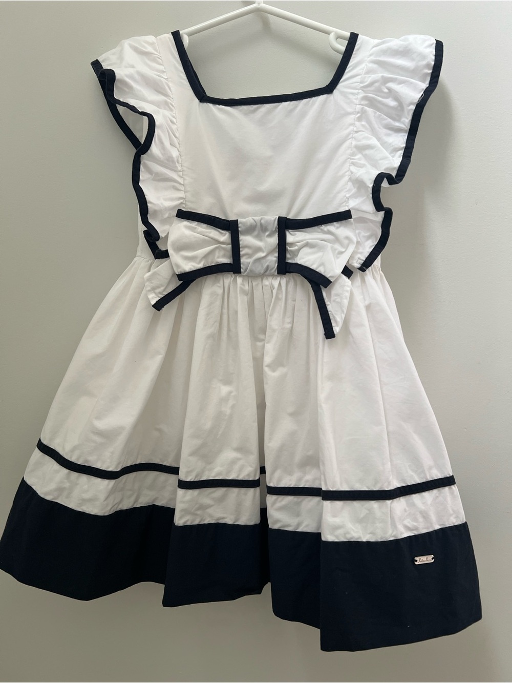 Patachou French Elegant Girls' White Dress with Black Trim and Bow Accent
